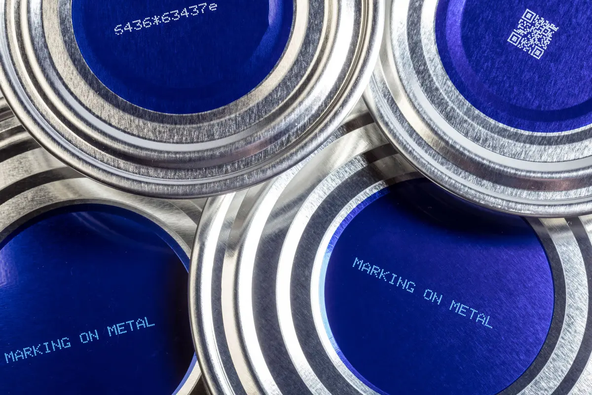 Metal labelled with white ink